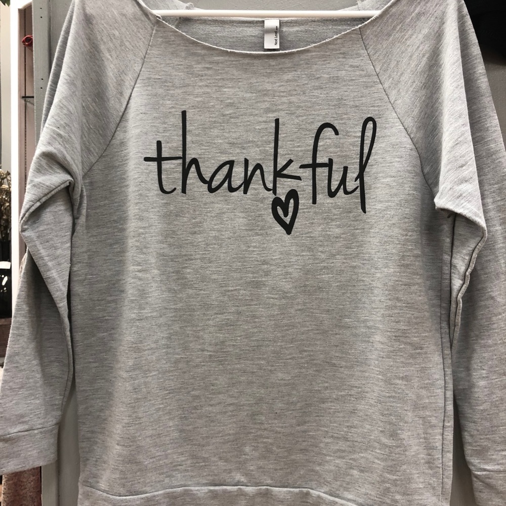 Glittering South open neck gray sweat shirt.